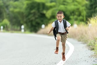 child running on the roadside 